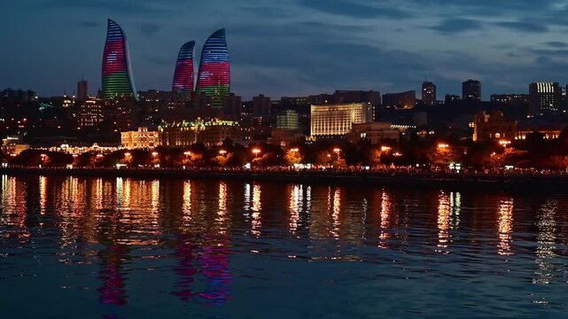 Cityscape of Baku, Azerbaijan taken at night time with the Flame Towers and Caspian Sea visible