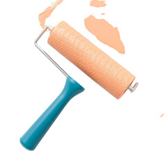 Obraz premium A bright orange paint roller with a blue handle is captured in motion splattering paint isolated on transparent background