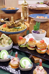 A close-up shot of a prepared table full of yummy meals for a party. buffet catering food arrangement on table