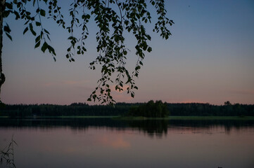 Fototapeta premium Beautiful and calm summer lake landscape at sunset in the dusk