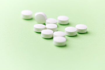 Hyaluronic acid tablets. Hyaluronic acid helps skin stretch and flex and reduces skin wrinkles. Bright paper background. Soft focus. Close up. Copy space	