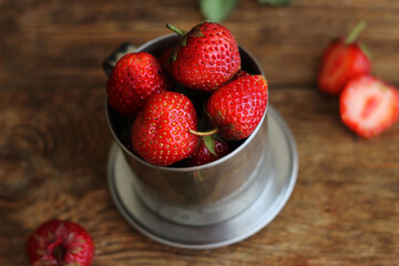 Strawberries in a metal bucket
