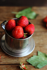 Strawberries in a metal bucket