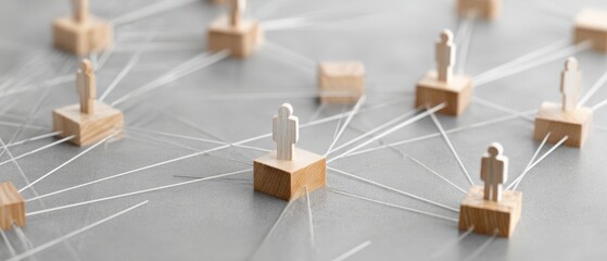 The wooden figures representing networking and connection in a collaborative digital space.