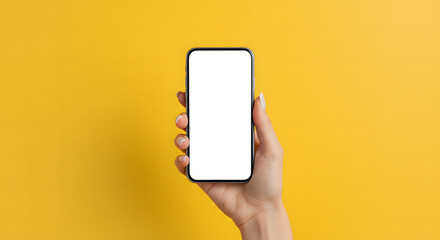 Hand holding smartphone with blank white screen, isolated on yellow background, mobile mockup for design display.