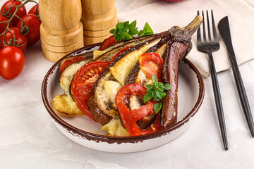 Baked tomato with mozzarella and tomato