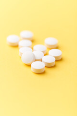 Hyaluronic acid tablets. Hyaluronic acid helps skin stretch and flex and reduces skin wrinkles. Bright paper background. Soft focus. Close up. Copy space	