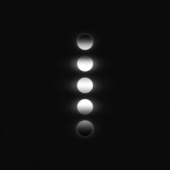 Vertical column of five graduated circles of light, from dark to light gray, on a black background