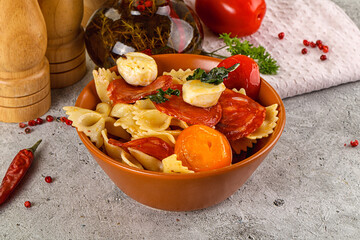 Italian pasta farfalle with pepperoni
