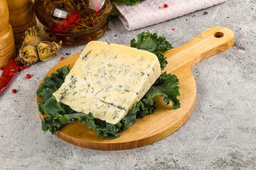 Blue cheese piece over board