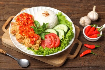 Ayam geprek is a typical Indonesian fried chicken dish with flour that is mashed or mashed with plow chili sauce