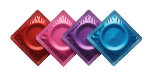 Four colorful condom wrappers arranged diagonally isolated on transparent background