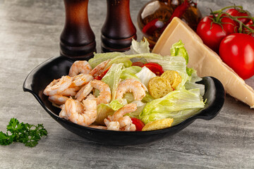 Tasty caesar salad with prawn