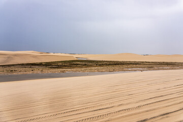 Dunes and lagoons of Atins, Lencois Maranhenses, Barreirinhas, Brazil. White sand dunes with pools of fresh water