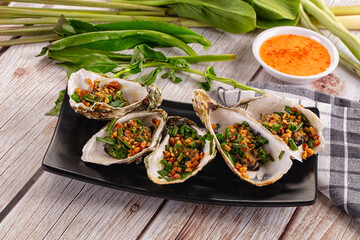 Gournet grilled oysters with onion and peanut