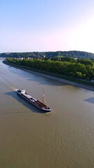 Obraz premium River barge on a tranquil waterway