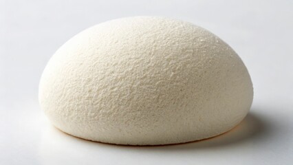 A close up view of a white hemispherical object with a textured surface on a white background