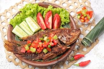 Ikan Nila Bakar. Grilled tilapia with dabu-dabu chili sauce