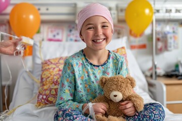 Smiling girl in hospital bed with teddy bear and balloons during treatment