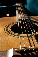 Fototapeta premium acoustic guitar, six-string, made of light wood, close-up. lifestyle
