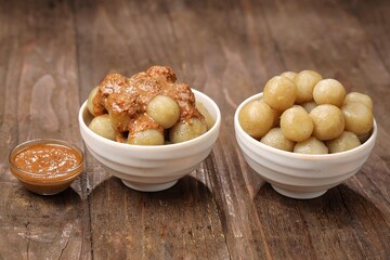 Cilok with spicy peanut sauce, a snack with a chewy and savory texture, with a spicy taste that burns the tongue