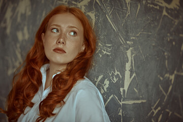 thoughtful redhead woman