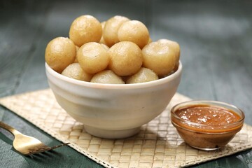 Cilok with spicy peanut sauce, a snack with a chewy and savory texture, with a spicy taste that burns the tongue