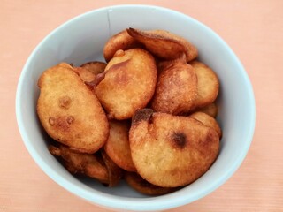 Close-up of freshly fried traditional Indonesian snack cakes in a bowl