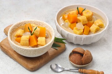 Kolak Pisang is an Indonesian dessert made from bananas, pumpkin cooked with coconut milk, palm sugar and pandan leaves.