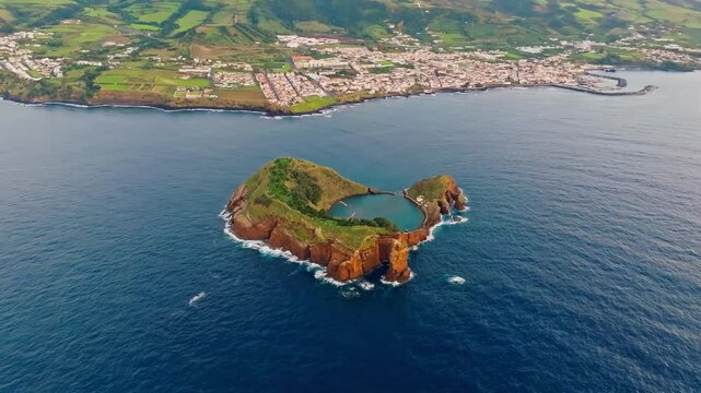 Aerial view of the volcanic islet Ilh&eacute;u de Vila Franca do Campo with its crater lagoon surrounded by the deep blue Atlantic, Vila Franca do Campo, Acores, Portugal.