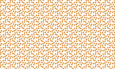 Abstract pattern of tiny orange and brown shapes on a light background