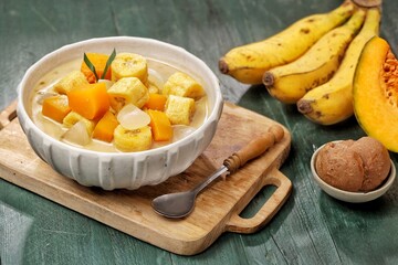 Kolak Pisang is an Indonesian dessert made from bananas, pumpkin cooked with coconut milk, palm sugar and pandan leaves.