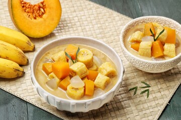 Kolak Pisang is an Indonesian dessert made from bananas, pumpkin cooked with coconut milk, palm sugar and pandan leaves.