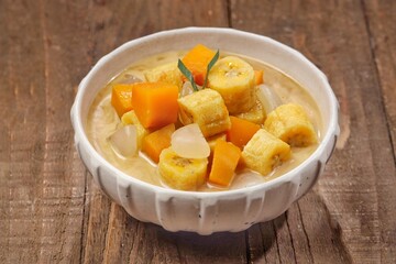 Kolak Pisang is an Indonesian dessert made from bananas, pumpkin cooked with coconut milk, palm sugar and pandan leaves.