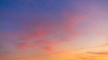 Clouds and orange sky in the morning background,Dusk,Pink and red sunlight and Dramatic storm clouds on Twilight sky, Landscape horizon Golden sky nature Summer Background , Sunset Sky.