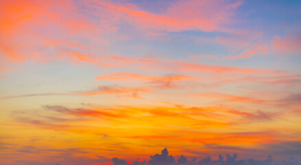 Clouds and orange sky in the morning background,Dusk,Pink and red sunlight and Dramatic storm clouds on Twilight sky, Landscape horizon Golden sky nature Summer Background , Sunset Sky.