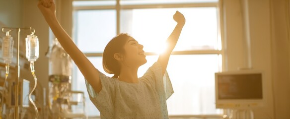 The joyful woman celebrating recovery in a sunlit hospital room.