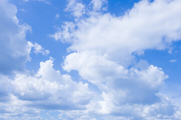 Clouds and daytime sky,Clear blue sky, sunny day, soft white clouds, ideal peaceful background, weather-related concepts, sunlight shining brightly, calm soothing environment, expansive overhead view