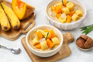 Kolak Pisang is an Indonesian dessert made from bananas, pumpkin cooked with coconut milk, palm sugar and pandan leaves.