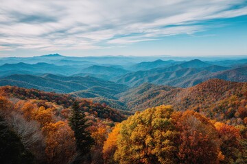 Autumnal mountain vista. Colorful foliage blankets hillsides, fading to hazy blue ridges in a distant valley