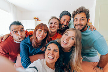 Group of friends taking selfie having fun at home