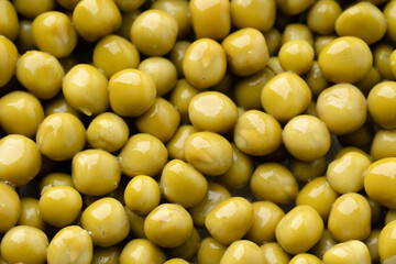 Fresh green peas background, texture of perfect peeled sweet pea grains as background. Vegetable background, vegetable protein, healthy products. Canned peas. spinning in a circle