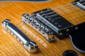 Electric guitar with natural pattern isolated on black background.