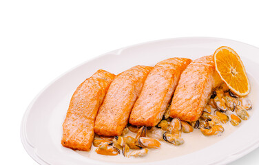 Savory baked salmon fillets garnished with citrus and shellfish