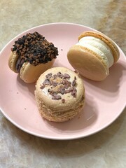 Colorful macarons with a delicate, crispy shell and soft, flavorful filling. Perfect for dessert photography, showcasing these elegant French treats in a variety of flavors and vibrant pastel colors.