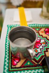 Vertical photo of accessories during a baptism ceremony