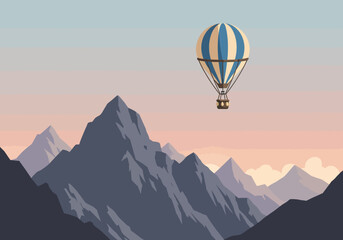 Fototapeta premium Blue and Beige Striped Hot Air Balloon Soaring Over Majestic Mountains.