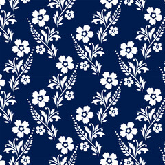 Pattern with plant ornament.Vector seamless pattern with white floral ornament on a blue background.