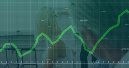 Displaying green line graph overlaying transparent grid across conference room, with laptops chairs