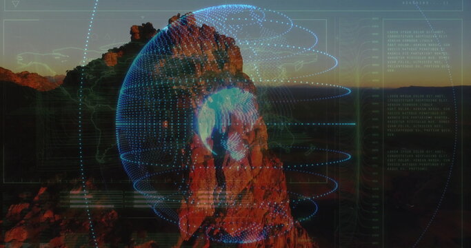 Fototapeta Displaying rock projecting digital globe with interface schematics streaming data in desert canyon